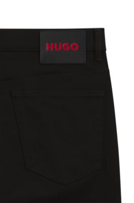 Vaqueros slim fit en denim el&aacute;stico negro de gran comodidad, Negro