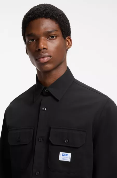 Oversized-fit cotton shirt with chest flap pockets