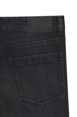 Vaqueros tapered fit en denim negro el&aacute;stico y c&oacute;modo, Negro