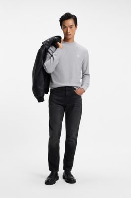 Vaqueros tapered fit en denim negro el&aacute;stico y c&oacute;modo, Negro
