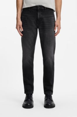 Vaqueros tapered fit en denim negro el&aacute;stico y c&oacute;modo, Negro