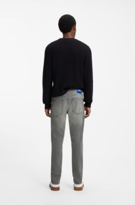 Vaqueros skinny-fit en denim el&aacute;stico gris deste&ntilde;ido, Gris