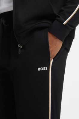 Pantalones de ropa de sal&oacute;n de algod&oacute;n con cinta con la raya caracter&iacute;stica de la firma, Negro