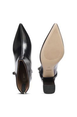 Botas de piel brillante con puntera afilada y detalle de hebilla, Negro