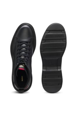 Half boots in leather with textured panels, Black