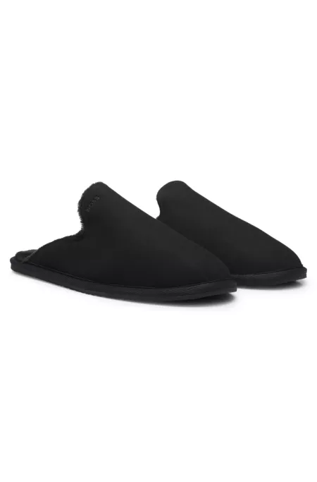 Shearling-lined slip-on slippers with logo detail