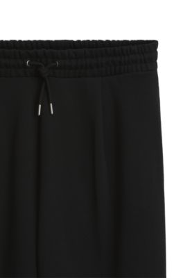 Pantalones de ch&aacute;ndal relaxed fit de felpa de algod&oacute;n, Negro