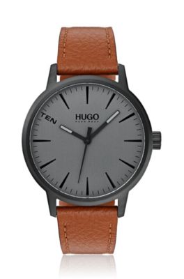 Black-plated watch with tan leather strap
