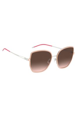 Nude-frame sunglasses with forked temples and branded chain