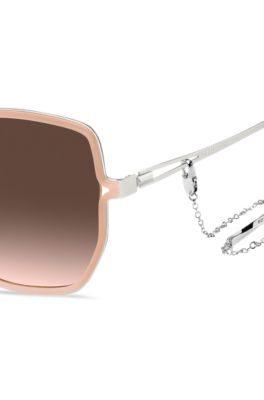 Nude-frame sunglasses with forked temples and branded chain