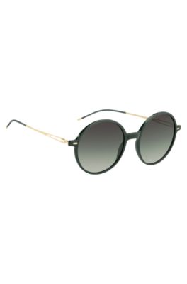 Round-frame sunglasses in green acetate with branded chain