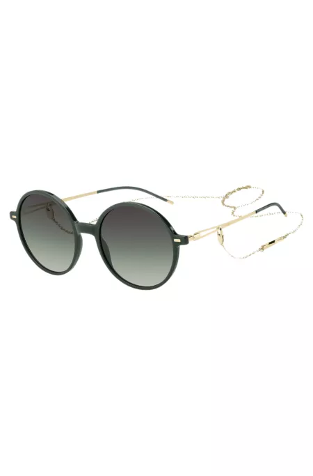 Round-frame sunglasses in green acetate with branded chain