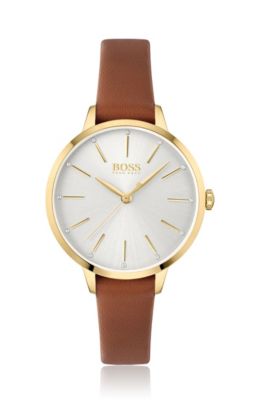 Gold-toned watch with crystal accents and leather strap