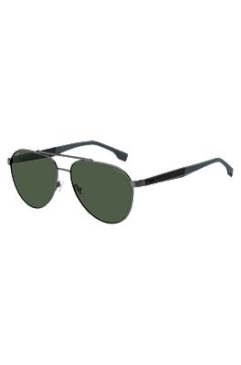 Double-bridge sunglasses with green-shaded lenses