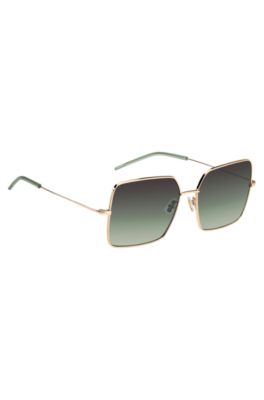 Gold-tone sunglasses with green end-tips