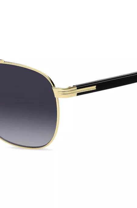 Double-bridge sunglasses in black and gold tones