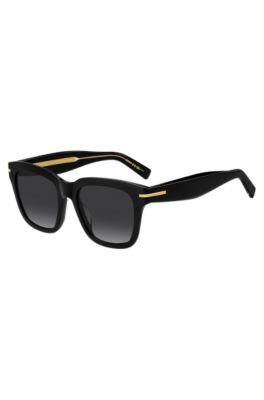 Black-acetate sunglasses with gold-tone detail
