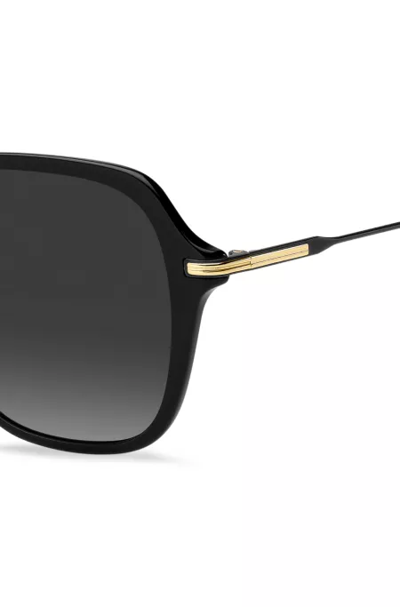 Metal-temple sunglasses in black acetate