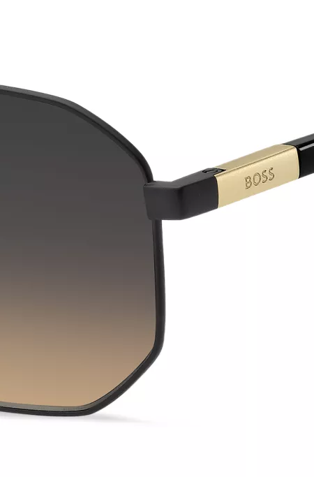 Black sunglasses with gold-tone logo insert