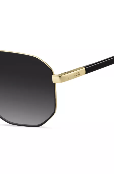 Black sunglasses with gold-tone trims