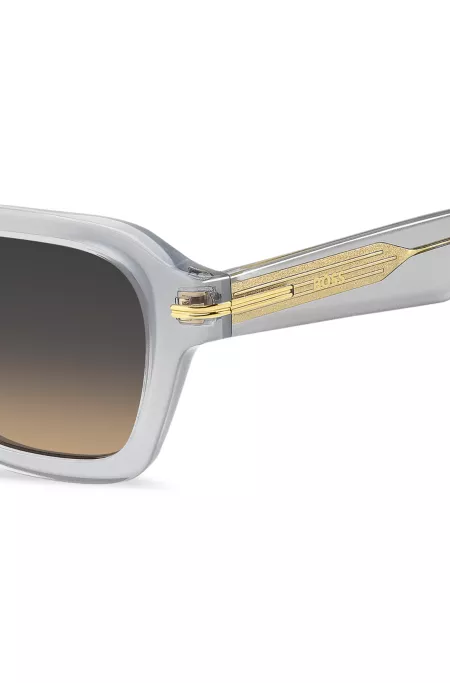 Temple-stripe sunglasses in clear acetate