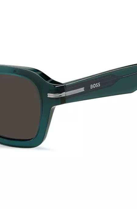 Temple-logo sunglasses in green acetate