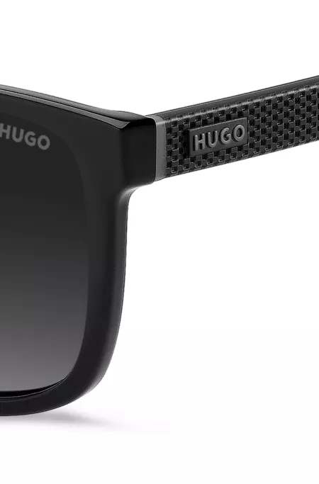 Matte-black sunglasses with patterned temples
