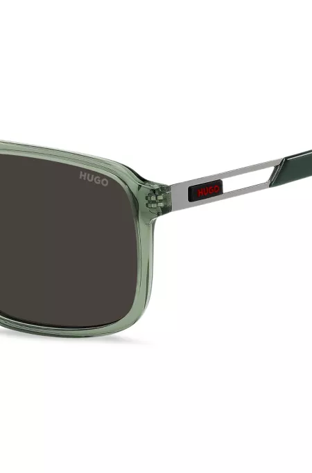 Green-acetate sunglasses with cut-out temples