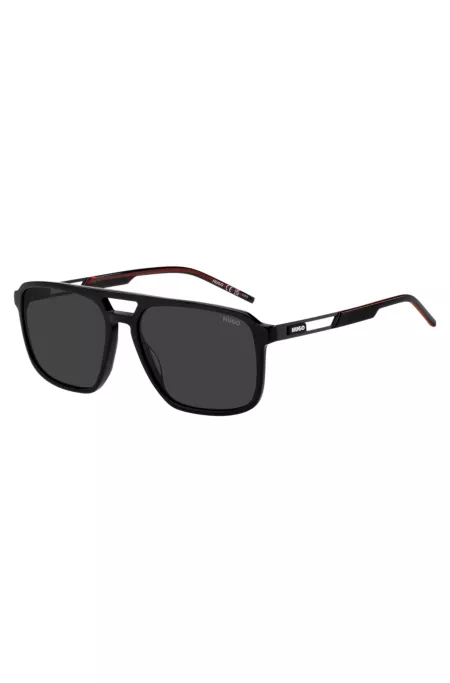 Rubber-logo sunglasses in black acetate