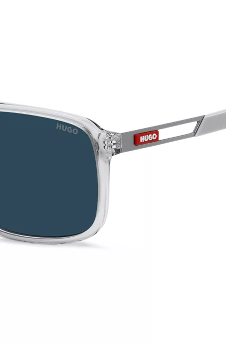 Rubber-logo sunglasses in clear acetate