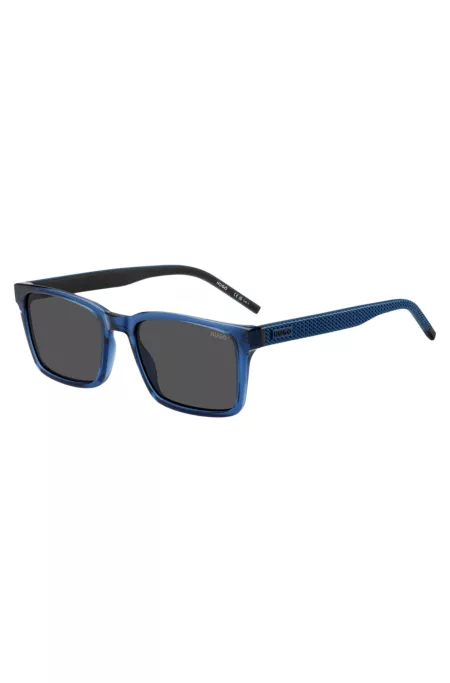 Transparent-blue sunglasses with patterned temples