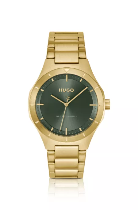 Lit gold-tone watch with green dial