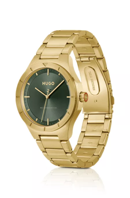 Lit gold-tone watch with green dial
