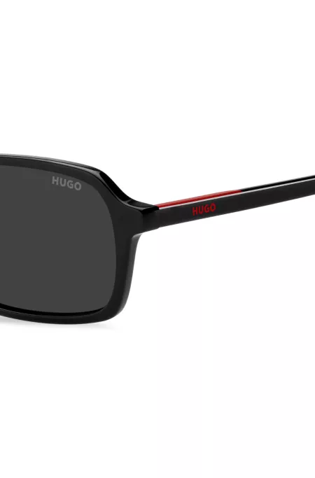 Black acetate sunglasses with red trim