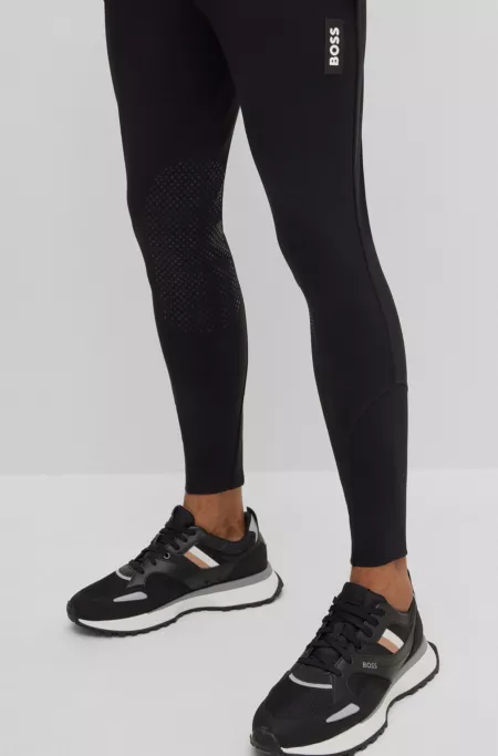 Equestrian knee-grip breeches in power-stretch material