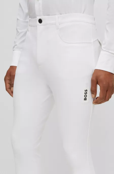Equestrian knee-grip breeches in power-stretch material