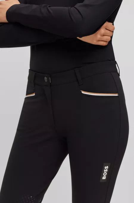 Equestrian knee-grip breeches in power-stretch material