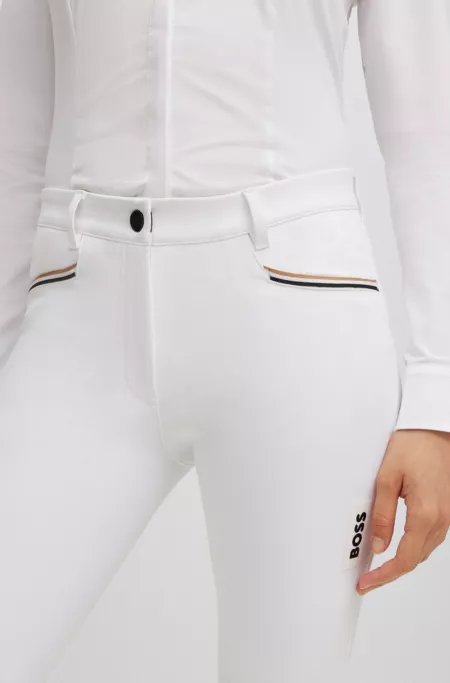 Equestrian knee-grip breeches in power-stretch material