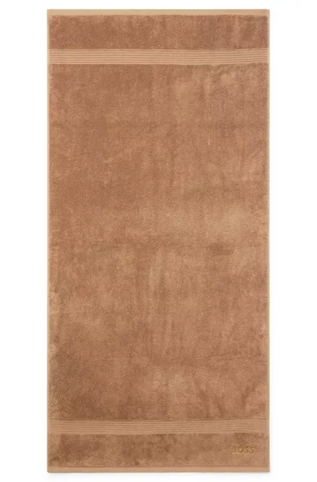 Cotton bath towel with tonal embroidered logo