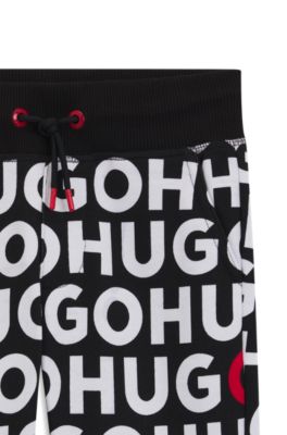Kids' cotton-blend tracksuit bottoms with repeat-logo print, Patterned