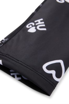 Kids' stretch leggings with logo and hearts print, Black