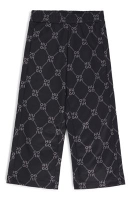 Kids' loose-fit tracksuit bottoms with stacked-logo print, Black