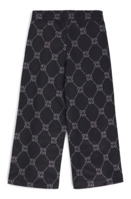 Kids' loose-fit tracksuit bottoms with stacked-logo print, Black