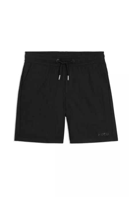 Kids' swim shorts with logo print