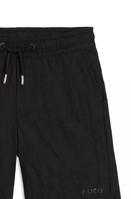 Kids' swim shorts with logo print