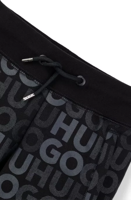 Kids' cotton-blend tracksuit bottoms with all-over logo print