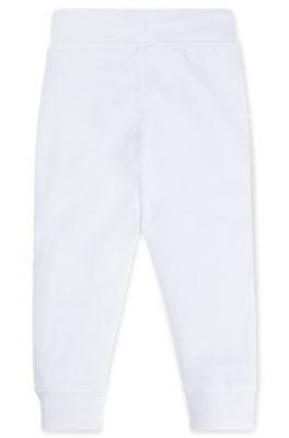 Kids' fleece tracksuit bottoms with marker-style logo, White