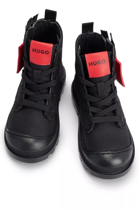 Kids' boots with branded leather zip puller