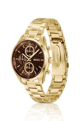 Gold-tone watch with monogram-textured dial
