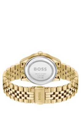 Gold-tone watch with green dial and pearlescent inlay